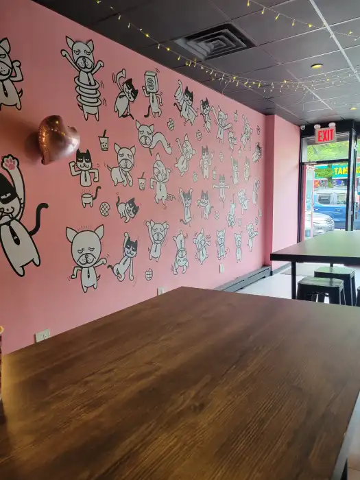 Momo Ashi pink character mural inside the shop